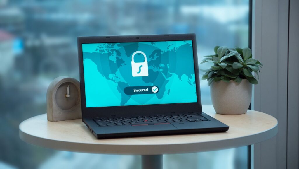 Laptop on a table showing a security lock icon